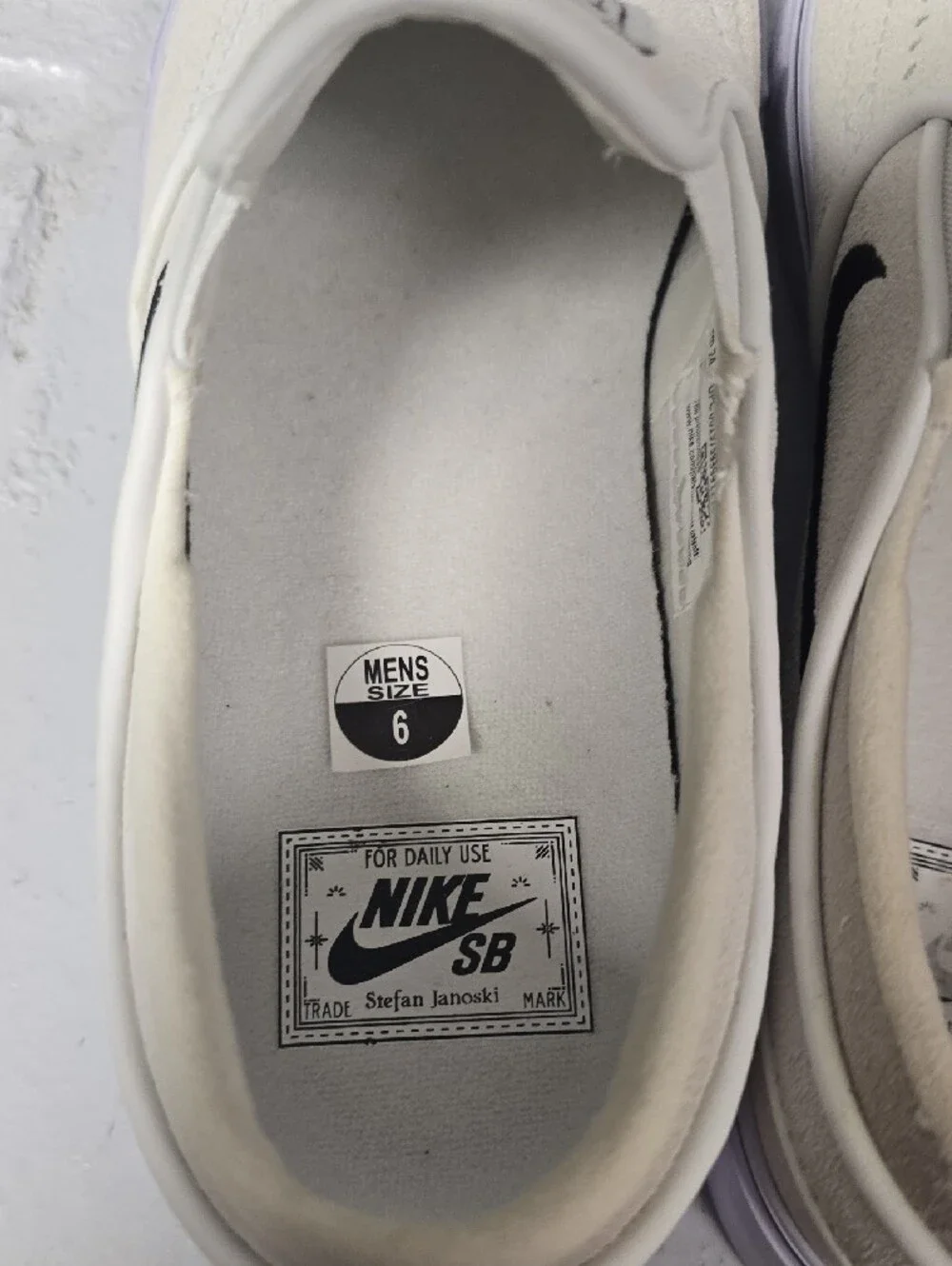 Nike Slip-On Sneakers in Off-White with Black Swoosh